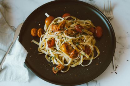 plate of burst cherry tomato pasta